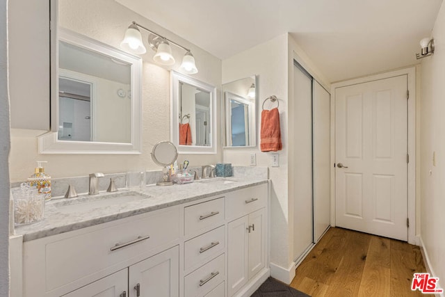 bathroom featuring vanity and wood-type flooring