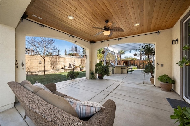 view of patio featuring grilling area, outdoor lounge area, ceiling fan, and a bar