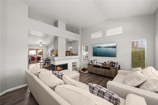 living room with lofted ceiling and dark hardwood / wood-style floors