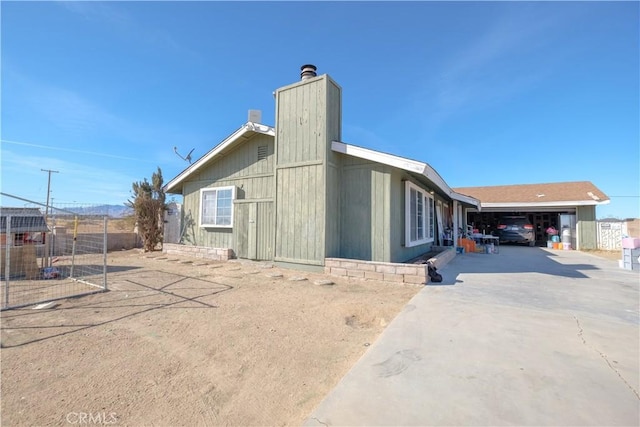 back of house with a garage