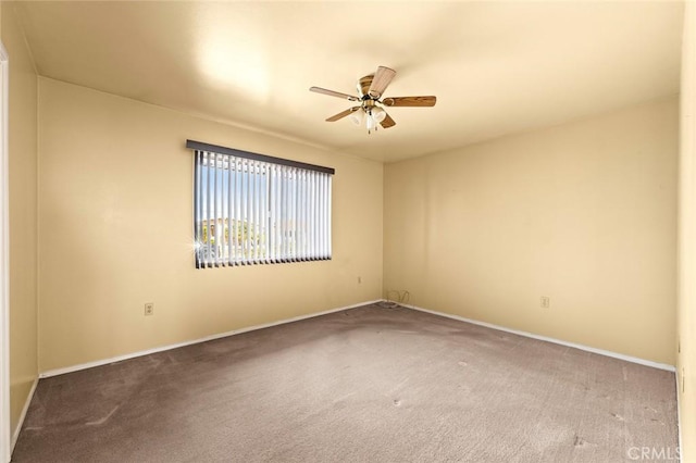 unfurnished room with ceiling fan and carpet floors