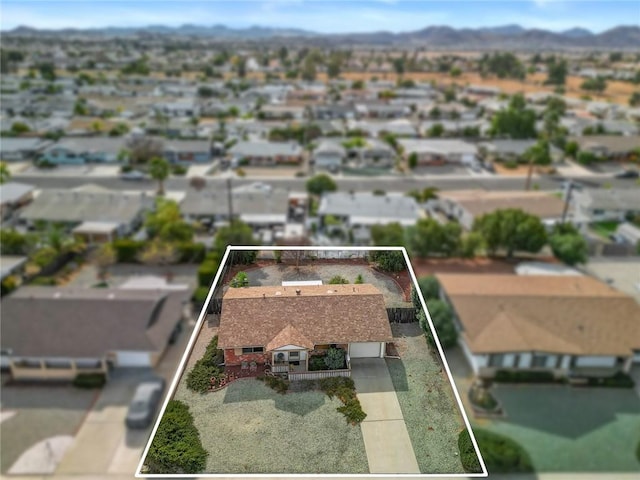 birds eye view of property with a mountain view