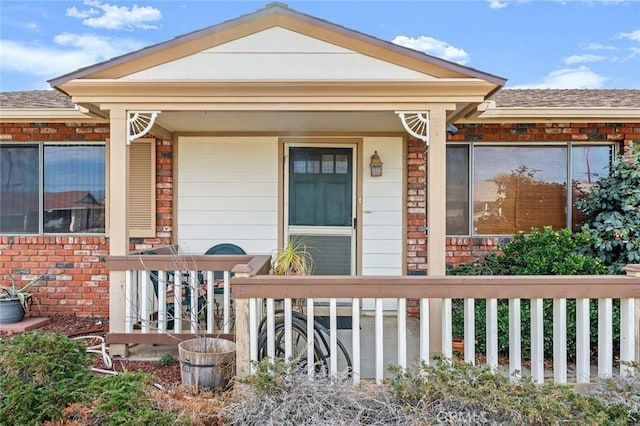 entrance to property featuring covered porch