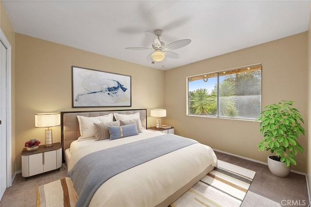 carpeted bedroom featuring ceiling fan