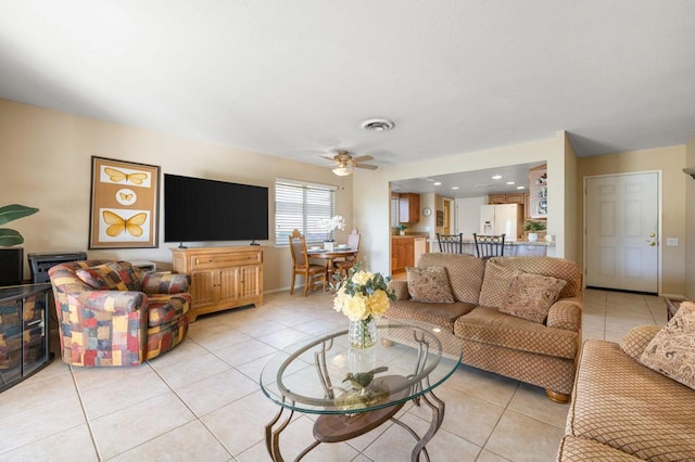 tiled living room with ceiling fan