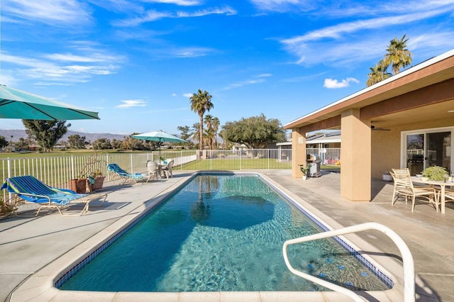 view of pool featuring a patio area and ceiling fan