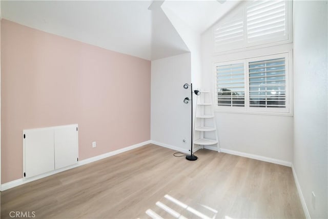 spare room with light hardwood / wood-style flooring