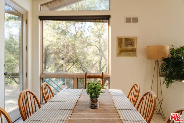 dining space featuring tile patterned flooring