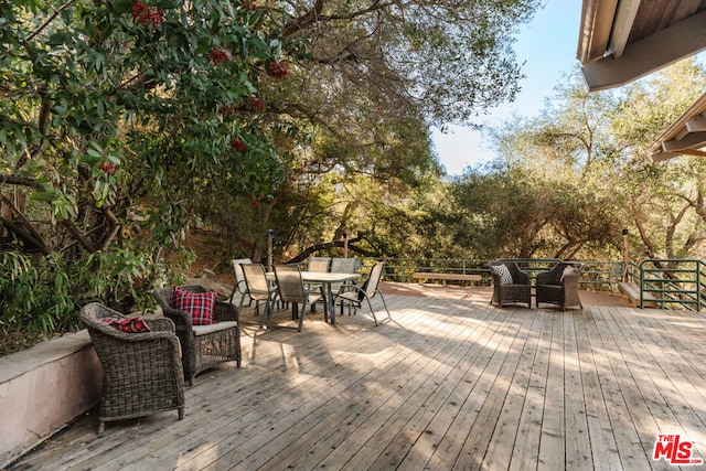 deck with an outdoor hangout area