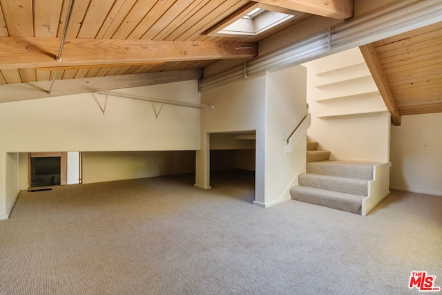 additional living space with light carpet, wood ceiling, and lofted ceiling with skylight