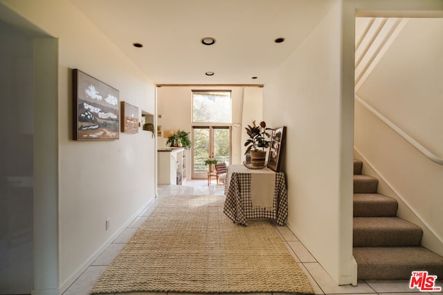 hallway featuring light tile patterned floors