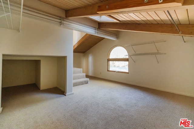 bonus room featuring wood ceiling, lofted ceiling with skylight, and light carpet