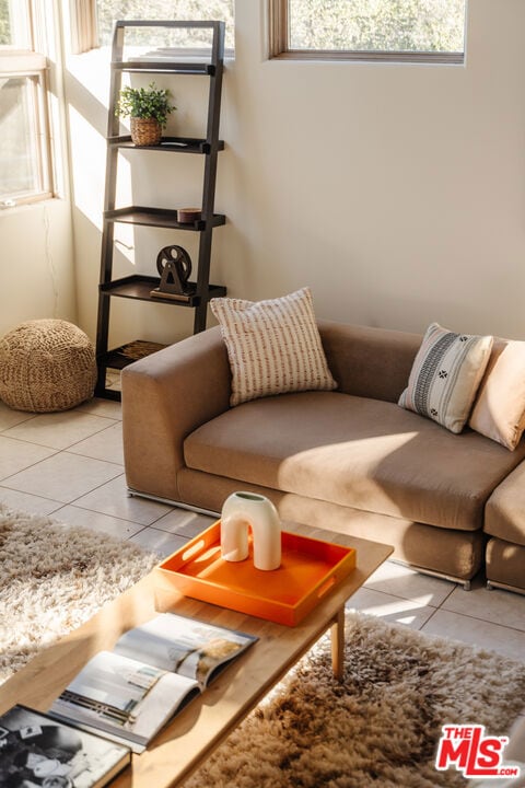 living room with light tile patterned floors