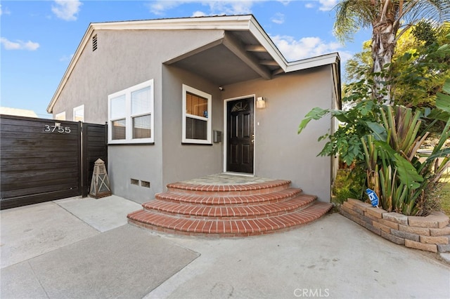 entrance to property with a patio area