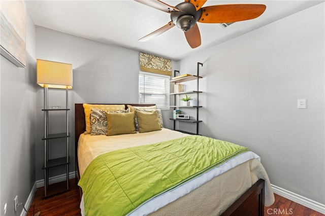 bedroom featuring dark hardwood / wood-style floors and ceiling fan