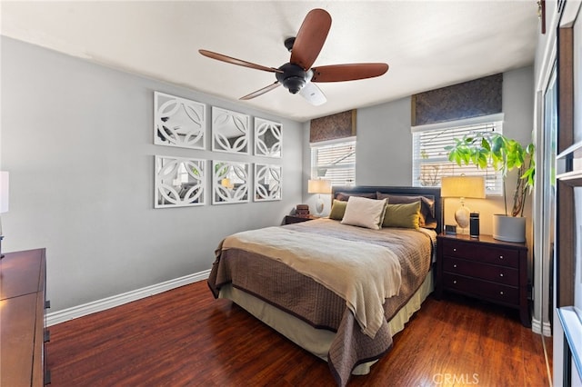 bedroom with ceiling fan and dark hardwood / wood-style flooring