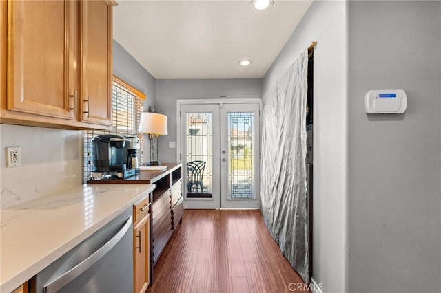 kitchen featuring dishwasher, light brown cabinetry, dark hardwood / wood-style flooring, and french doors