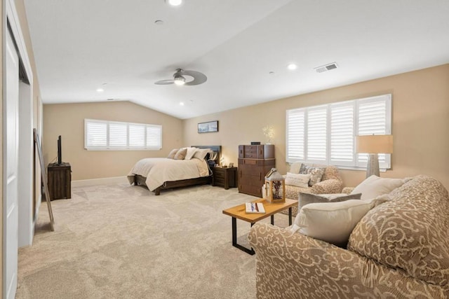 carpeted bedroom with vaulted ceiling and ceiling fan