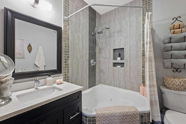 full bathroom with vanity, shower / tub combo with curtain, and toilet