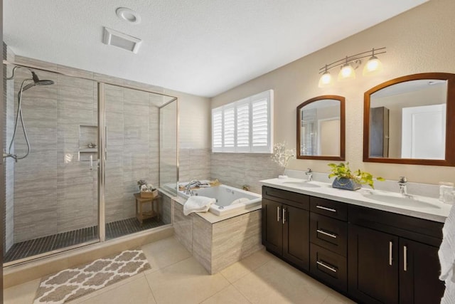 bathroom featuring tile patterned floors, independent shower and bath, and vanity