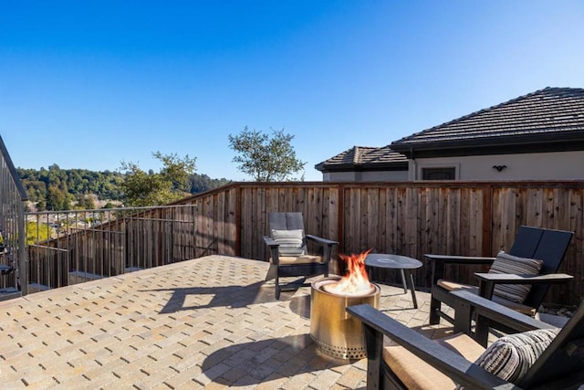 view of patio with a fire pit