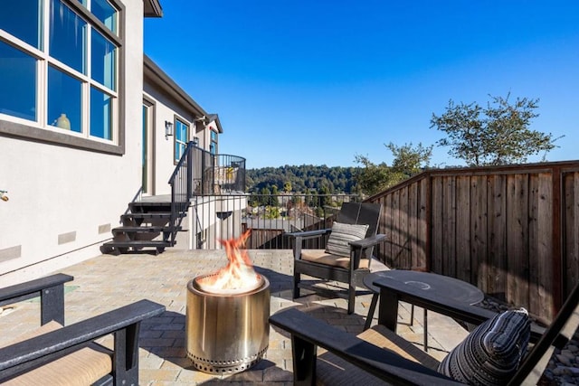 view of patio with a fire pit