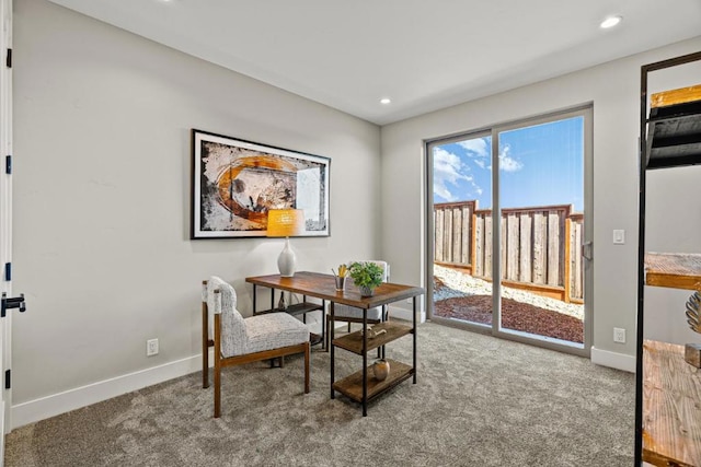 dining space featuring carpet flooring