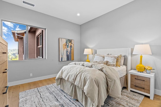 bedroom with light hardwood / wood-style flooring