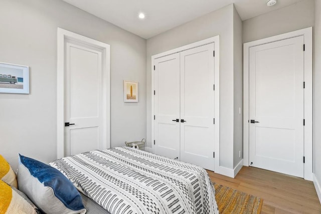 bedroom featuring light hardwood / wood-style floors and a closet