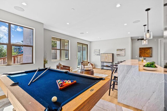 recreation room with light hardwood / wood-style flooring and billiards