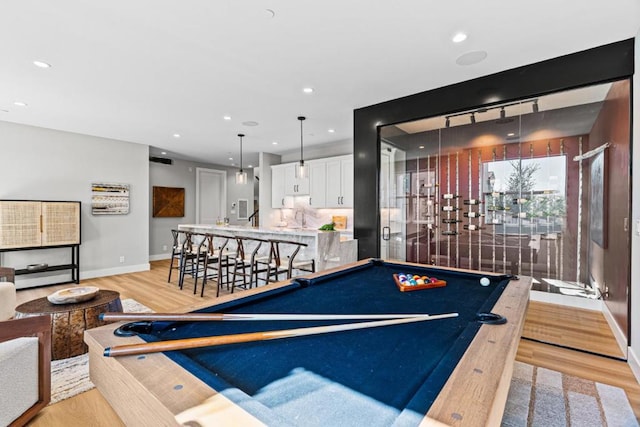 game room with sink, pool table, and light hardwood / wood-style floors