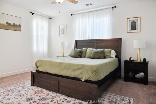 bedroom featuring light carpet and ceiling fan