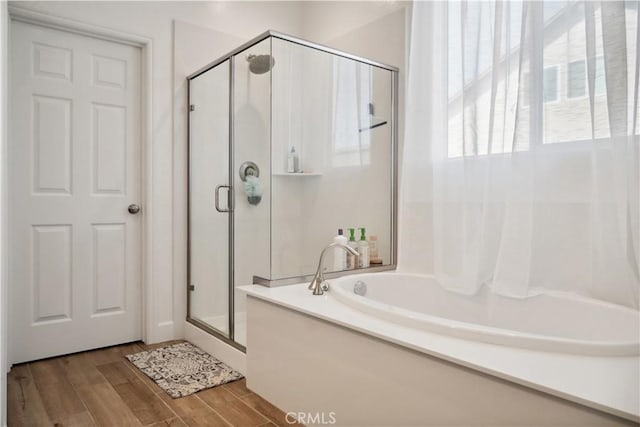 bathroom featuring plus walk in shower