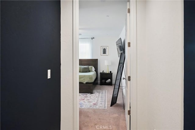 corridor featuring carpet flooring