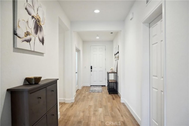 hall with light wood-type flooring