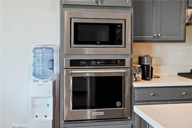 kitchen featuring gray cabinets and stainless steel appliances