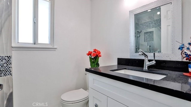 bathroom with vanity, toilet, an enclosed shower, and decorative backsplash