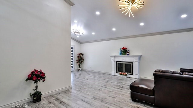 living room featuring ornamental molding and light hardwood / wood-style floors