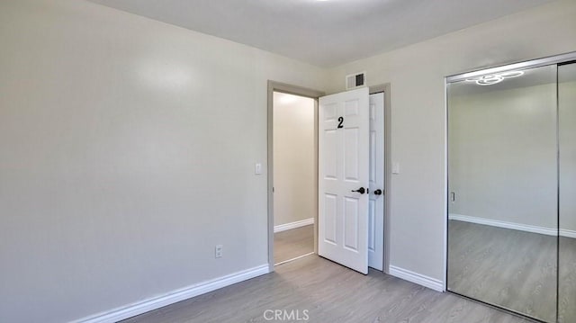 unfurnished bedroom featuring light hardwood / wood-style flooring