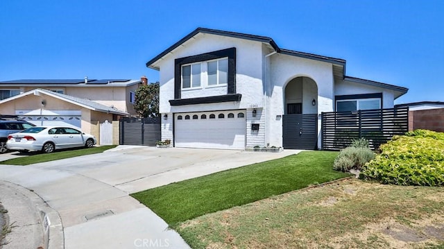 view of front of house with a garage and a front yard