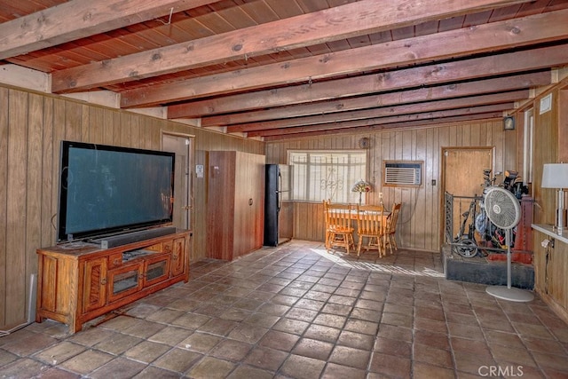unfurnished living room with beamed ceiling, wood ceiling, and wooden walls