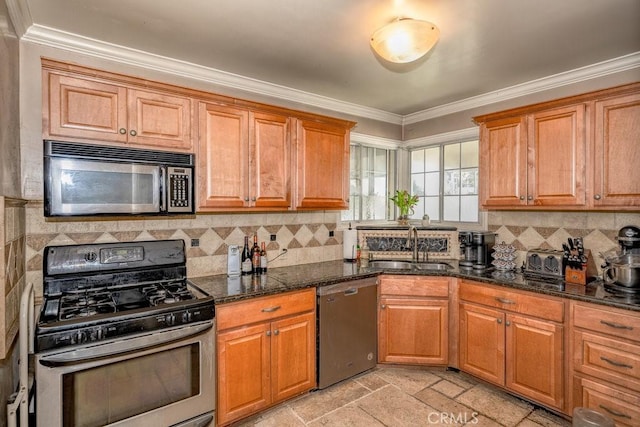 kitchen featuring stone tile floors, decorative backsplash, appliances with stainless steel finishes, ornamental molding, and a sink