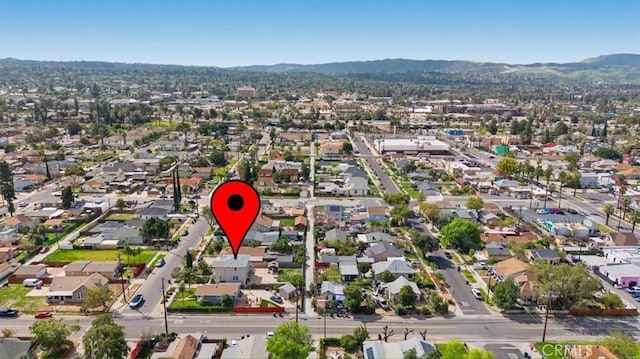 birds eye view of property with a residential view and a mountain view