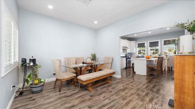 dining room featuring recessed lighting, baseboards, and wood finished floors