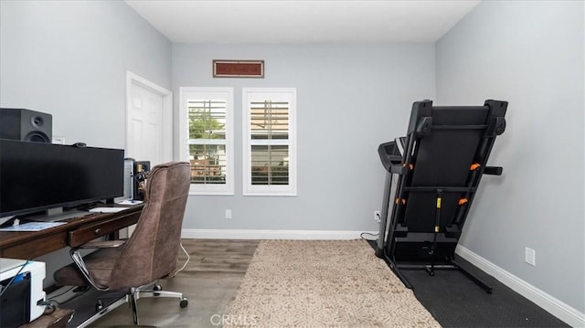 office area with wood finished floors and baseboards