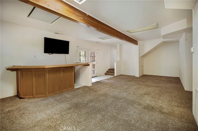 bar with beamed ceiling and light colored carpet