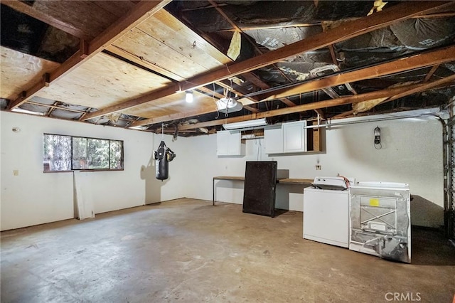 basement with washer and clothes dryer