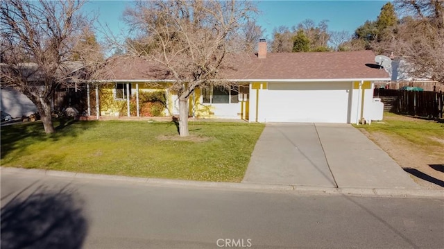 single story home featuring a garage and a front lawn