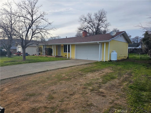 ranch-style home with a garage and a front yard