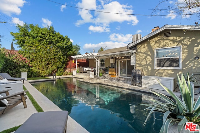 view of swimming pool featuring a patio and a pergola